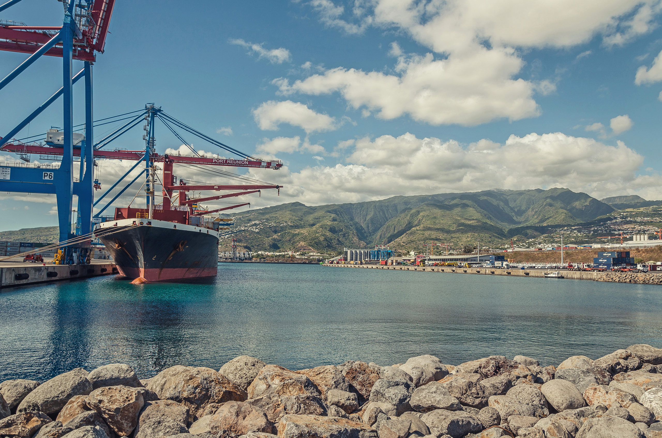 A big container ship is loading cargo in the port, Reunion